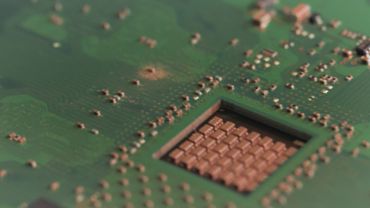 Closeup video of a motherboard with microchips