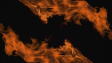 Two orange flames on black background