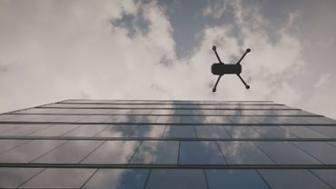 Drone flying over office building