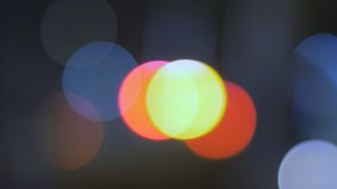 Blurred abstract cars lights at night with bokeh effect