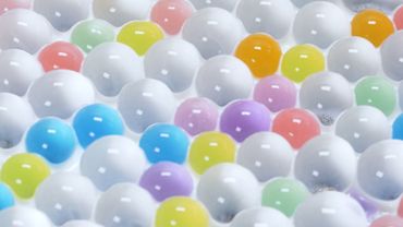 Colorful spheres floating in liquid