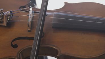 Man playing violin close up