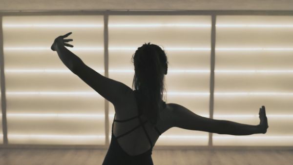 Silhouette of a contemporary dancer in studio
