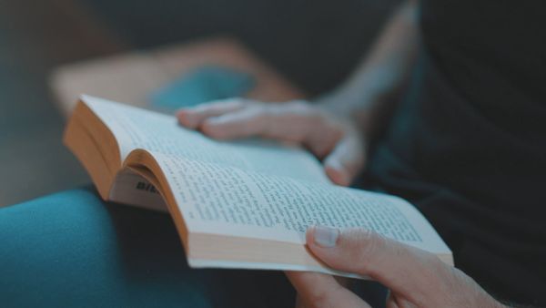 A person reading a book, close up