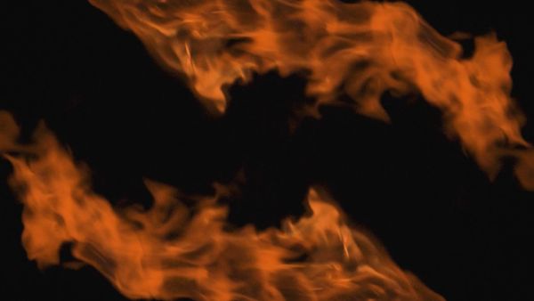 Two orange flames on black background