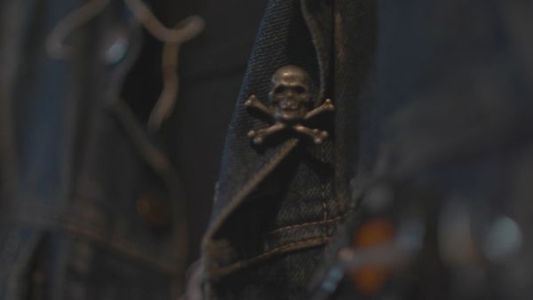 Skull pin on denim jacket