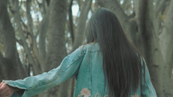 Woman walking in the forest