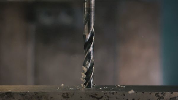 A drilling machine drilling steel